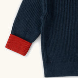 Little Green Radicals Knitted Snuggly Jumper in Midnight Blue with red cuffs, made from GOTS organic cotton.