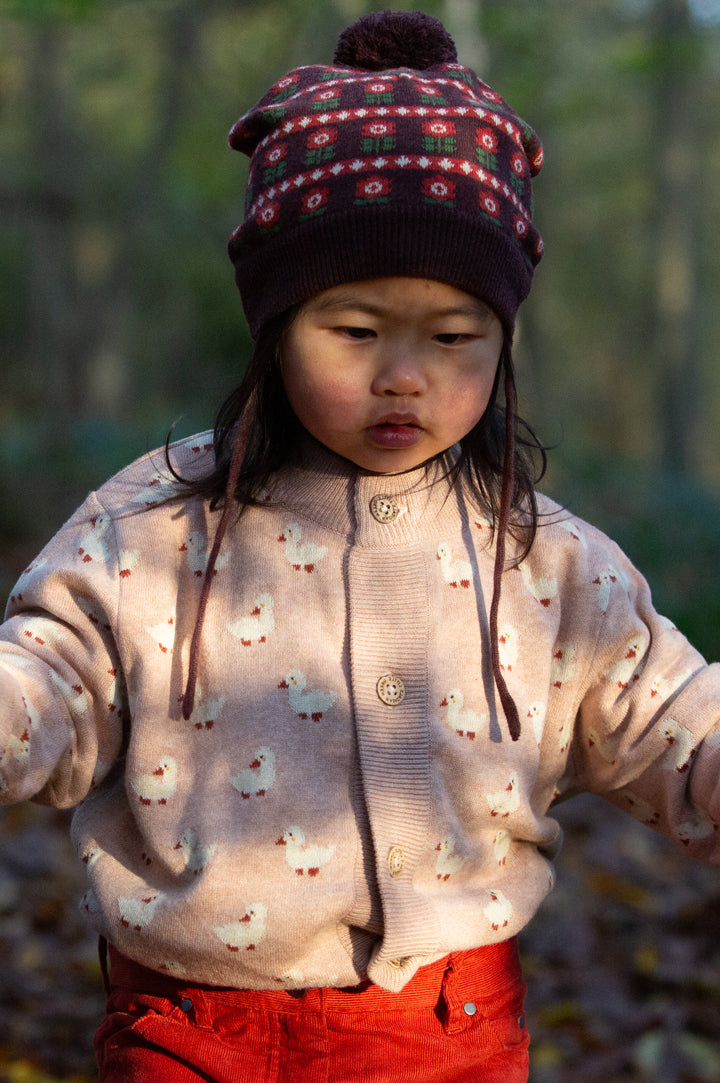 Child wearing Little Green Radicals Knitted Cardigan - Puddle Ducks to represent new Little Green Radicals organic cotton Knitwear at Babipur.
