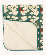 Little Green Radicals sherpa hooded baby blanket in a hedgerow design available at Babipur. A Organic cotton outer in dark green colour with a pretty floral design and a sherpa fleece inner