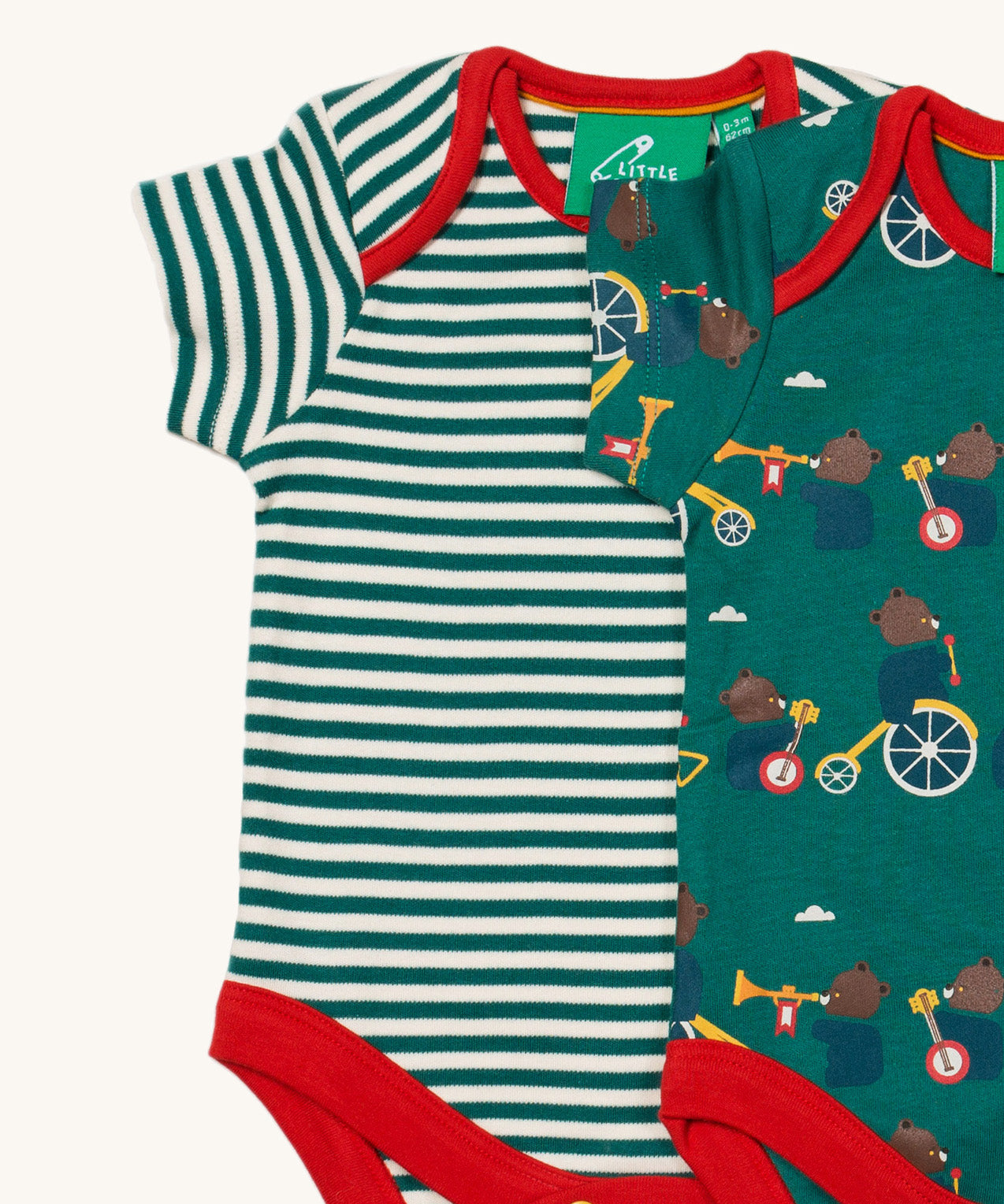 A close up of the A 2 pack of Little Green Radicals The Bear Jamboree Baby Body Set available at Babipur showing the red trim detail on both vests.