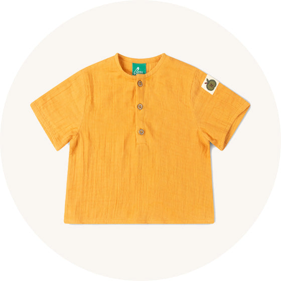 Little Green Radicals Short Sleeved Henley Top in Golden Ochre, made from organic muslin cotton, to represent all Little Green Radicals tops at Babipur. 
