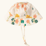 Little Green Radicals child's organic cotton reversible sunhat with a pink and yellow Flora print.