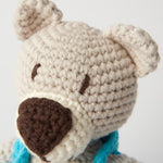 A closer look at the crochet detailing on the face of the Peace Bear