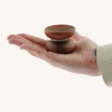 An adult hand holding the Mader free wheel butterfly yoyo available at Babipur showing scale