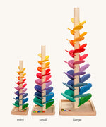 Comparison of Magic Wood Marble trees: mini, small and large. Satisfying wooden marble runs made of a tall stem, rainbow leaves and marbles.