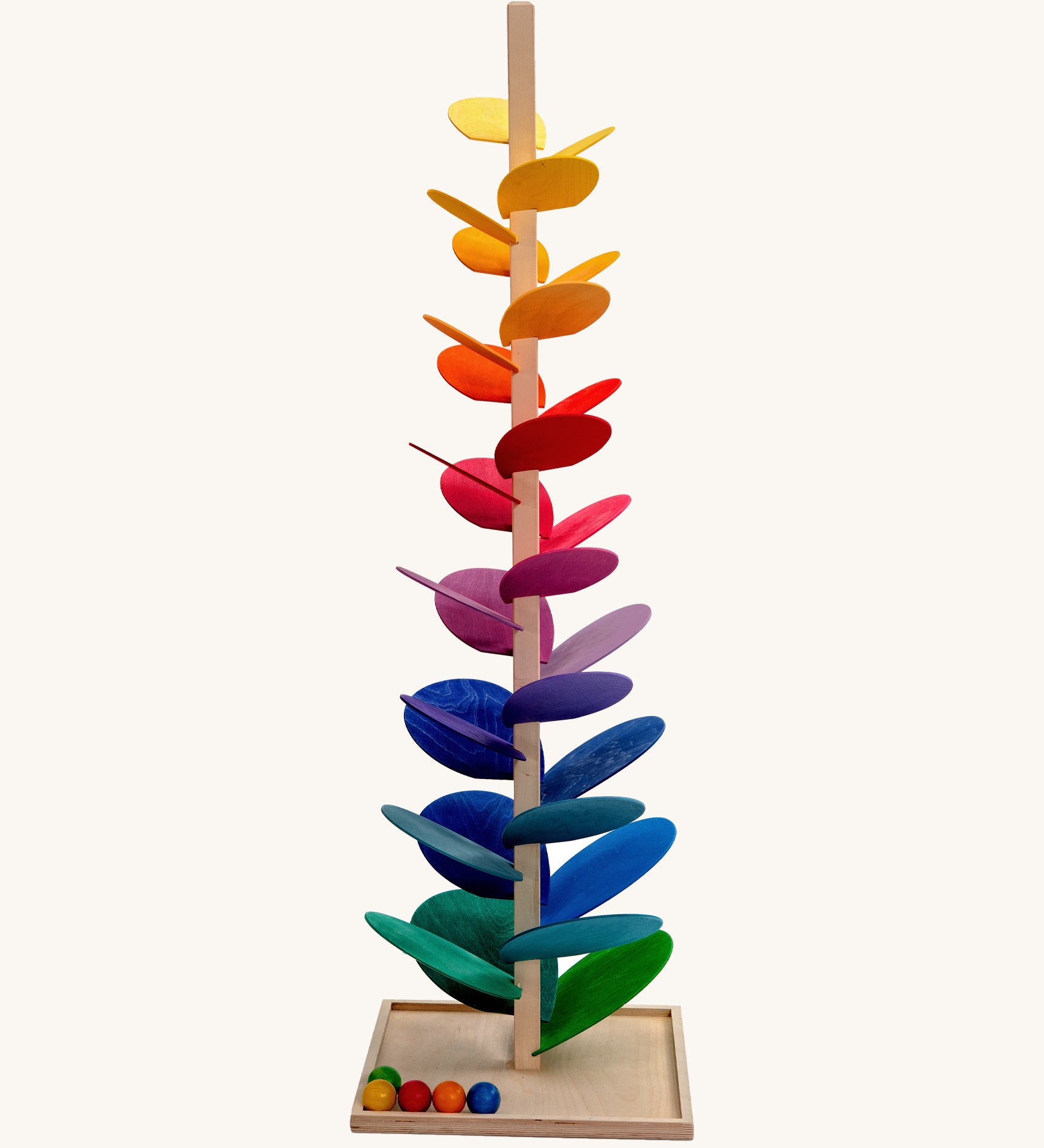 Magic Wood Giant Marble Tree Toy measuring 150cm, a wooden tall stem with rainbow leaves and glass marbles to create satisfying sounds.