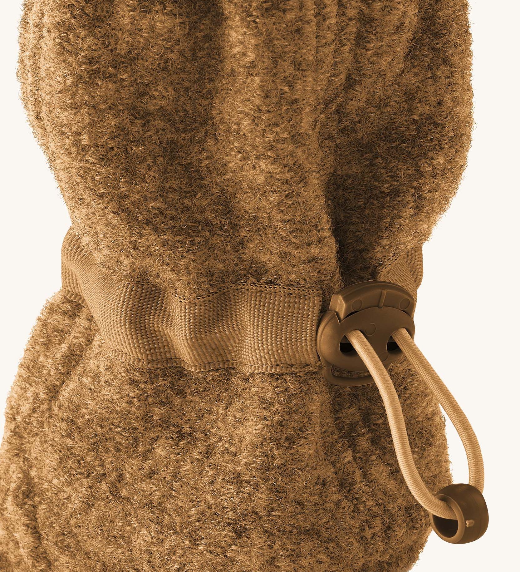 Mamalila Baby Wool Booties - in camel brown. Baby booties made from upcycled boiled wool available at Babipur. Photo shows elastic pull string ankle fastening