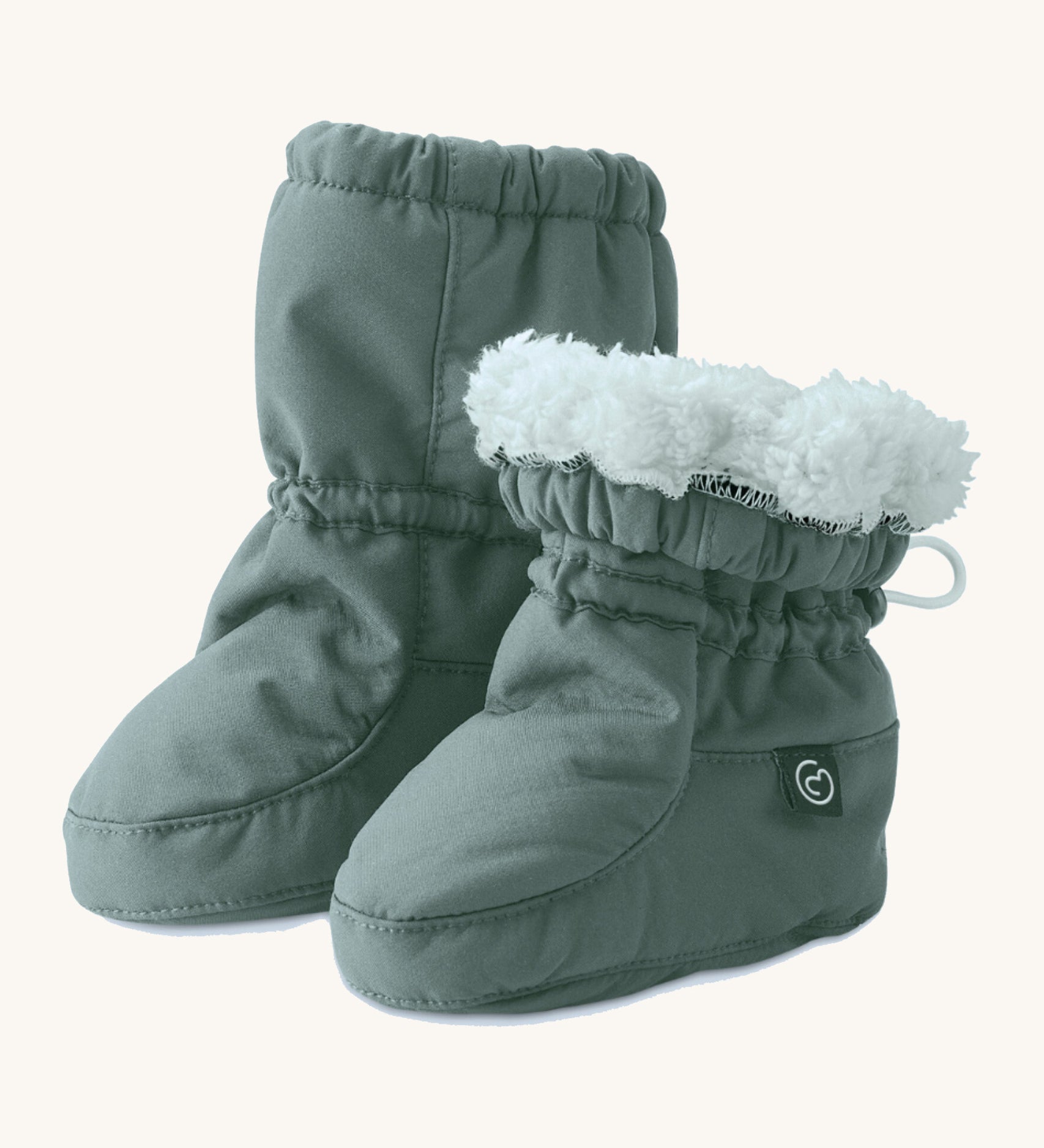 Mamalila cosy winter allrounder baby booties in the agave green colour available at Babipur. Features a thick white fleece inner liner