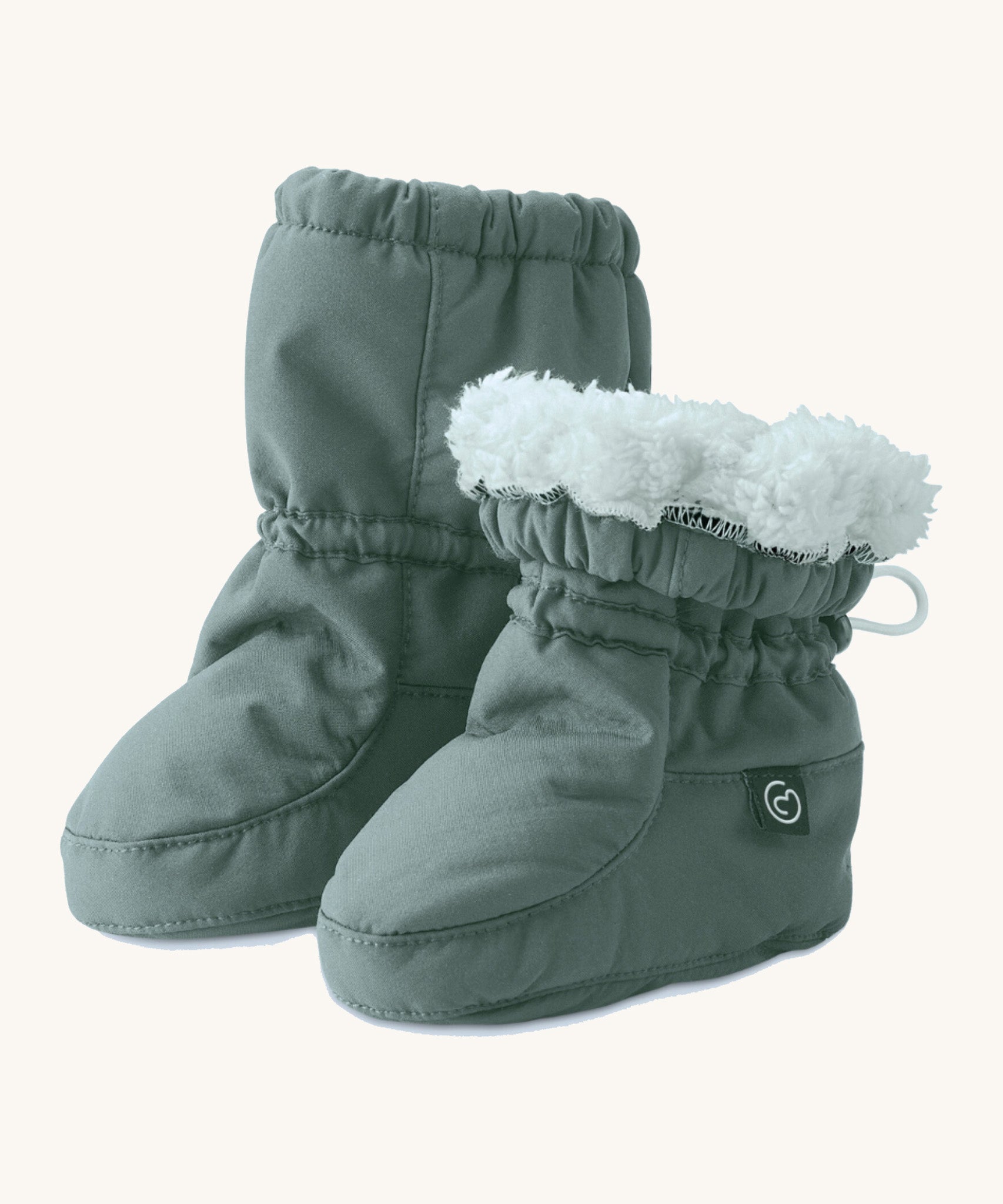 Mamalila cosy winter allrounder baby booties in the agave green colour available at Babipur. Features a thick white fleece inner liner