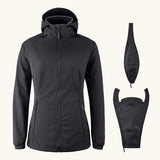 Mamalila soft shell baby wearing allrounder fitted jacket in black next to the 2 inserts included with the jacket
