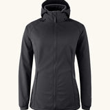 Mamalila soft shell baby wearing allrounder fitted jacket in black. This jacket features a hood, full length front zip and side pockets.