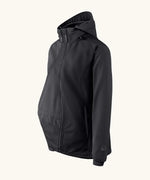 Side of Mamalila soft shell baby wearing allrounder fitted jacket in black. Showing additional panel on front