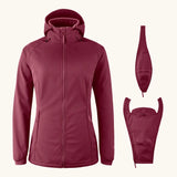 Mamalila soft shell baby wearing allrounder fitted jacket in burgundy next to the 2 inserts included with the jacket