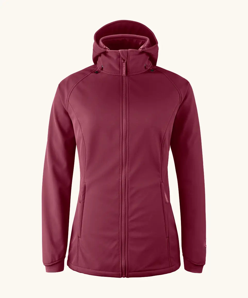 Mamalila soft shell baby wearing allrounder fitted jacket in burgundy. This jacket features a hood, full length front zip and side pockets.