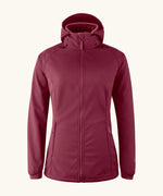 Mamalila soft shell baby wearing allrounder fitted jacket in burgundy. This jacket features a hood, full length front zip and side pockets.