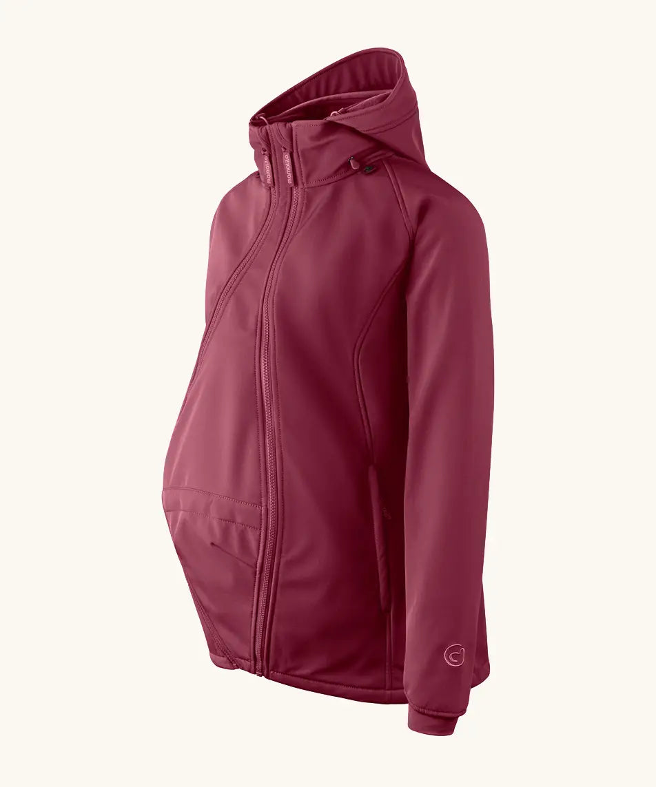 Side of Mamalila soft shell baby wearing allrounder fitted jacket in burgundy. Showing additional panel on front