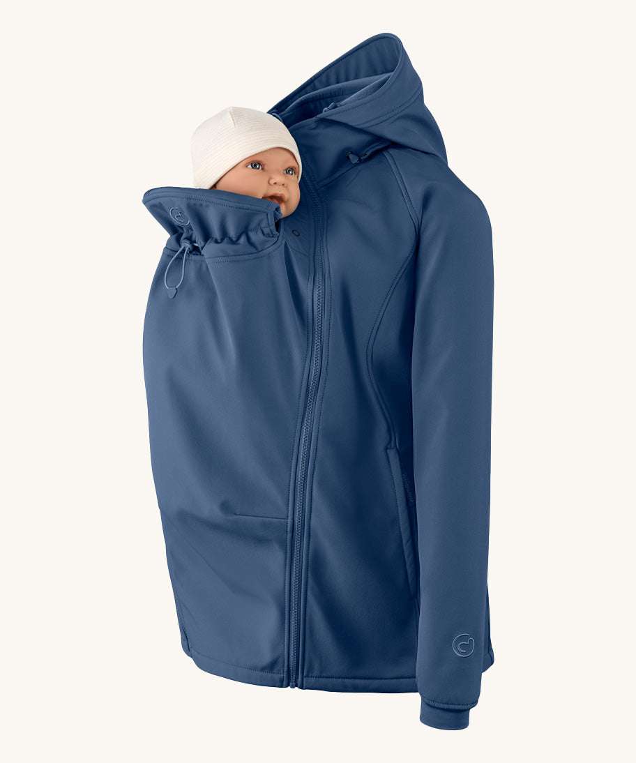 Mamalila soft shell baby wearing allrounder fitted jacket in navy available at Babipur with a baby doll demonstrating the forward sitting position with the protective hood down