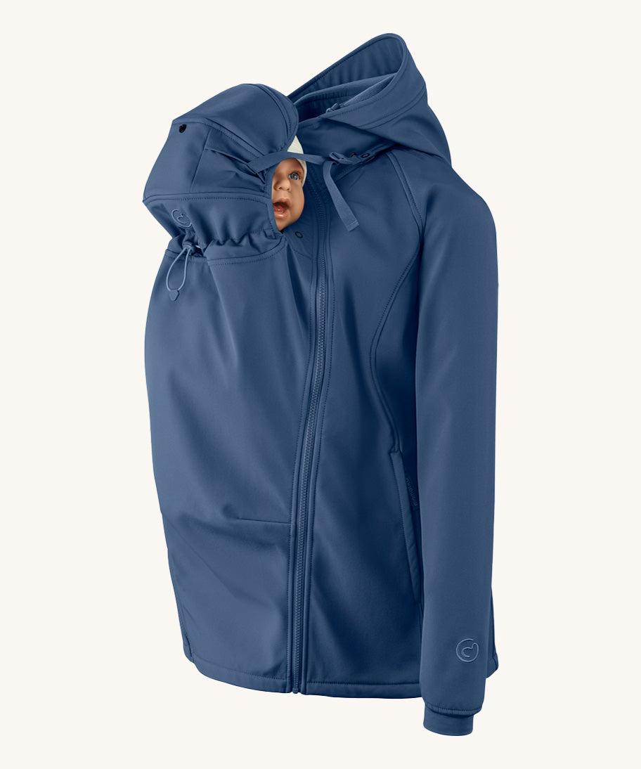 Mamalila soft shell baby wearing allrounder fitted jacket in navy available at Babipur with a baby doll demonstrating the forward sitting position with the protective hood covering the baby doll