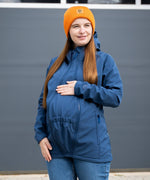 A mother wearing the Mamalila soft shell baby wearing allrounder fitted jacket in navy available at Babipur showing the fit of the jacket