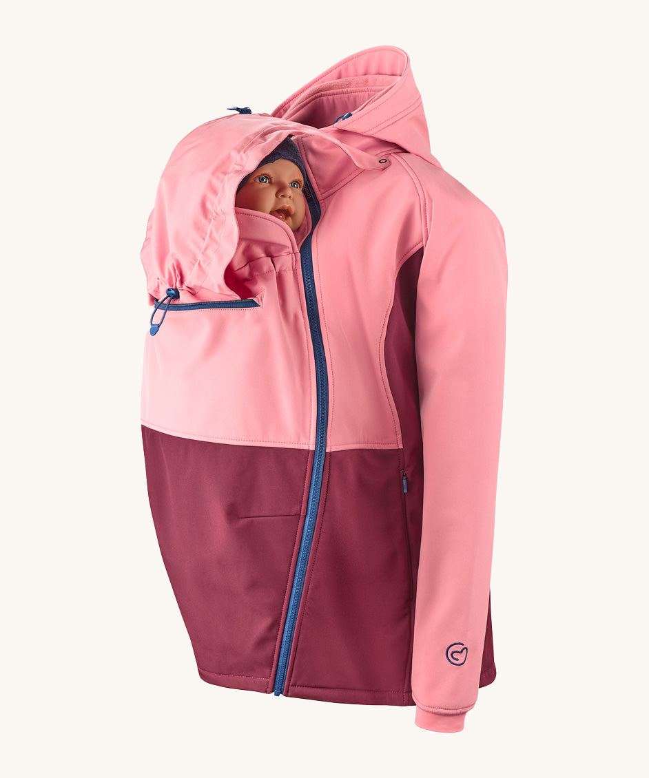 Mamalila soft shell baby wearing allrounder limited edition pro jacket in party purple available at Babipur with a baby doll demonstrating the forward sitting position with the protective hood up