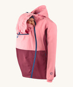 Mamalila soft shell baby wearing allrounder limited edition pro jacket in party purple available at Babipur with a baby doll demonstrating the forward sitting position with the protective hood up