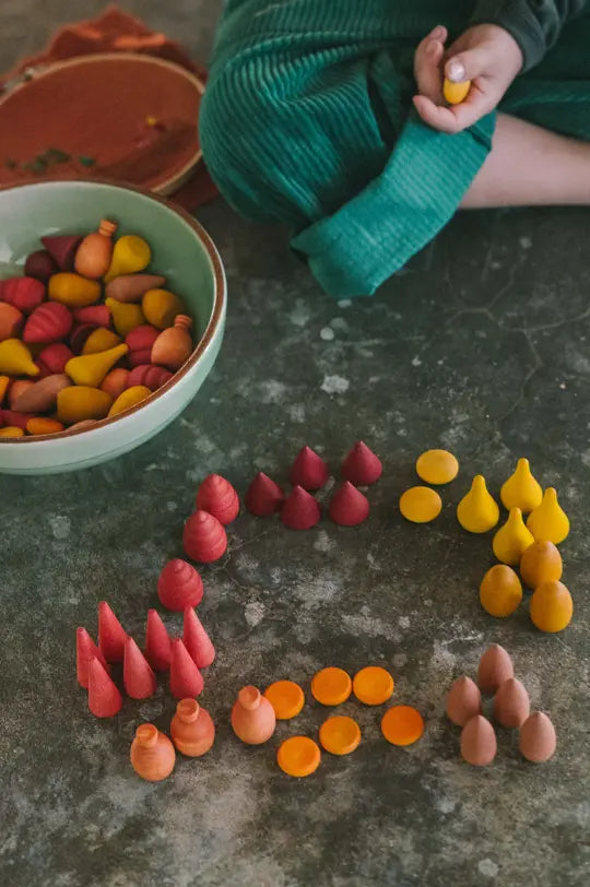 Grapat Warm mandala set, loose wooden toy hand-painted in reds, oranges and yellows.