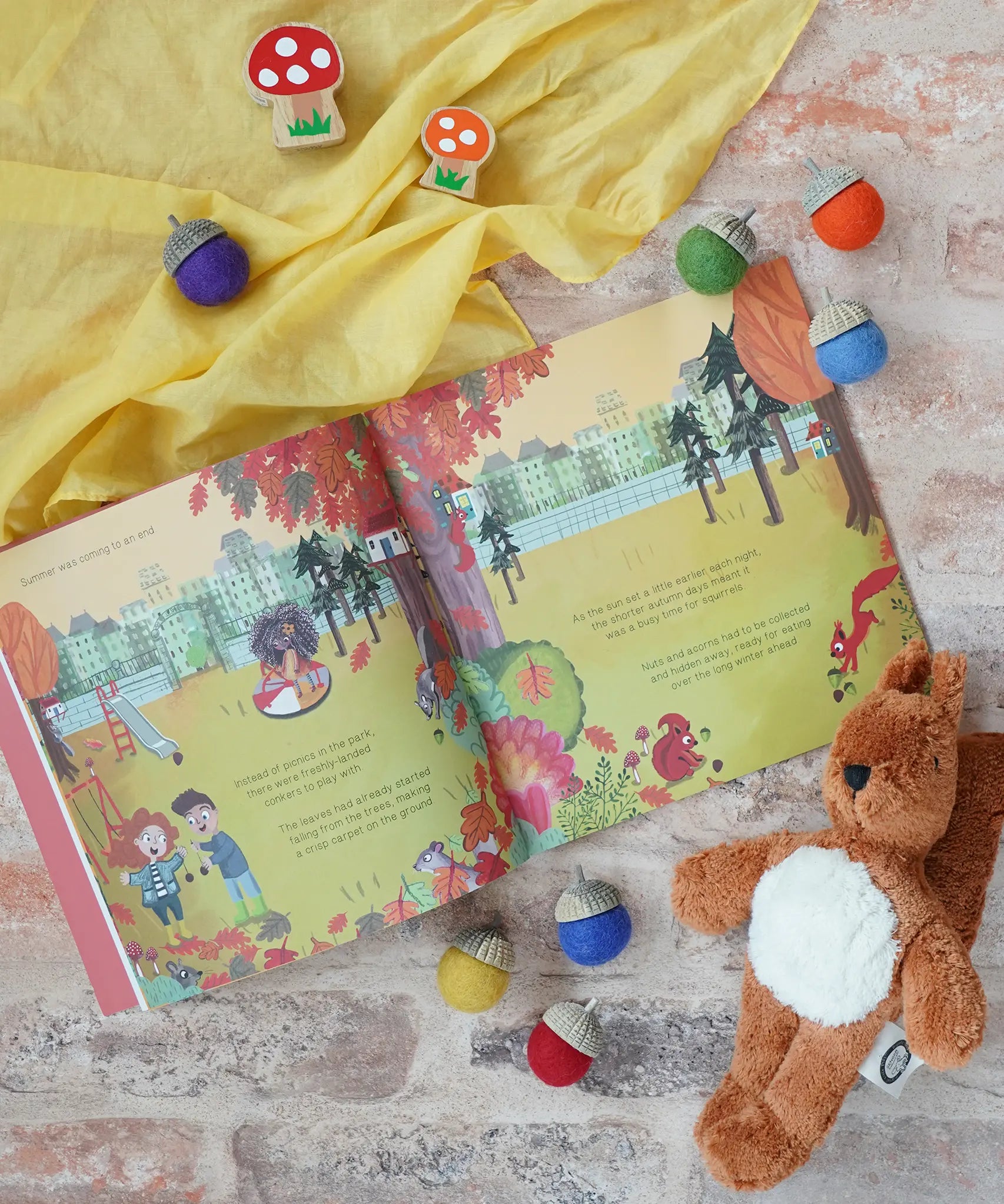 Marney's Mix Up by Jane Rushmore and Sally Darby, a children's autumnal book about squirrels collecting acorns, next to a Senger baby squirrel and Lanka Kade toadstools.