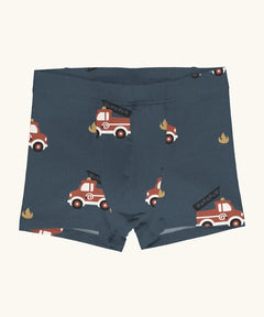 Maxomorra kids GOTS organic cotton boxer shorts in navy with a repeating cartoon style fire truck print. Features an elasticated waist band