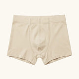 Maxomorra kids GOTS organic cotton boxer shorts in solid cream. Features an elasticated waist band