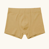 Maxomorra kids GOTS organic cotton boxer shorts in mustard yellow. Features an elasticated waist band
