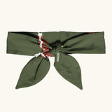 Maxomorra kids GOTS organic cotton hairband in green with a repeating cute fox print. Hairband is in a knot tie style 