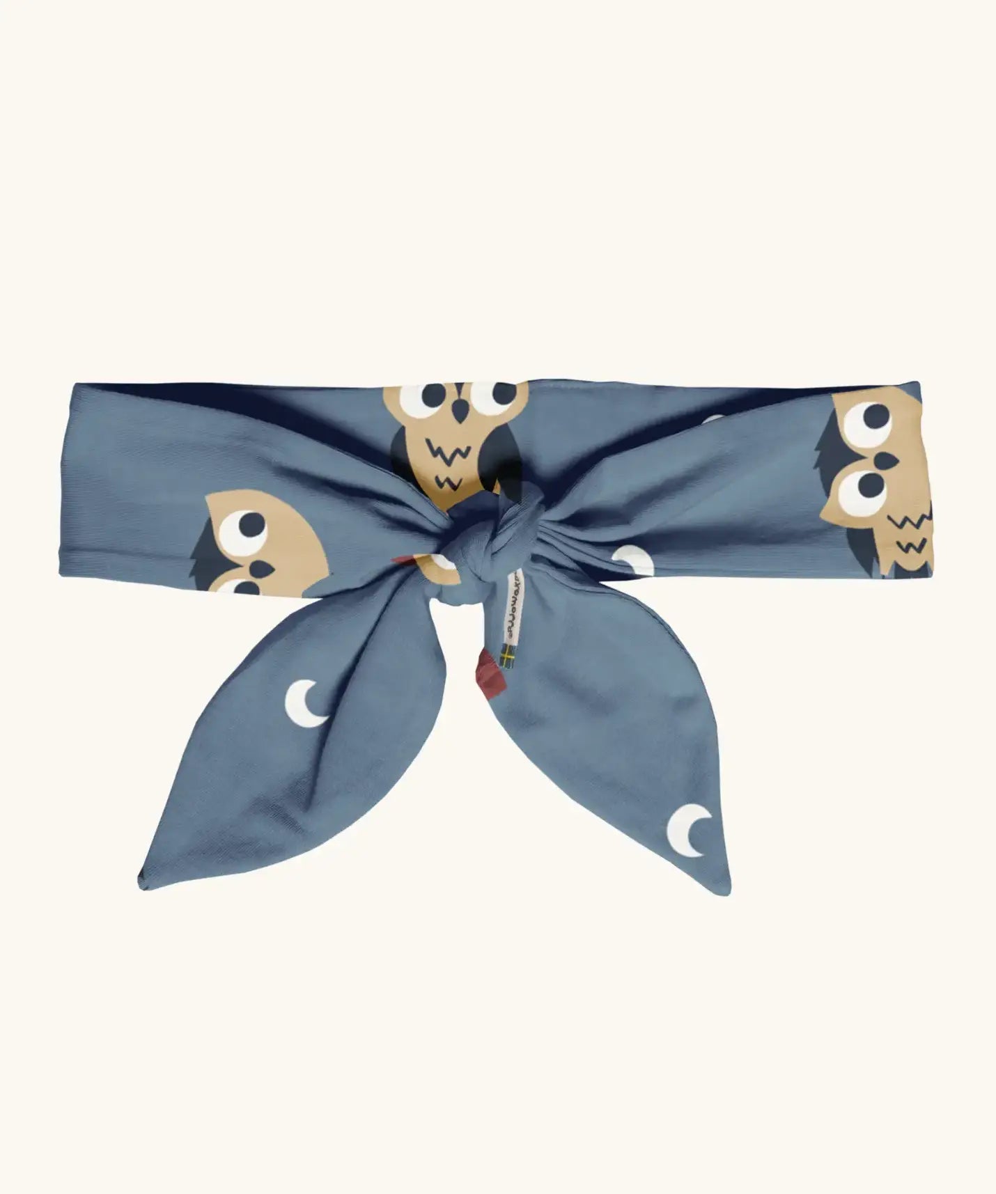 Maxomorra kids GOTS organic cotton hairband in blue with a repeating cute owl print. Hairband is in a knot tie style 