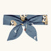 Maxomorra kids GOTS organic cotton hairband in blue with a repeating cute owl print. Hairband is in a knot tie style 