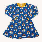 Maxomorra Organic Cotton Rainbow Long Sleeve Circle Dress in blue fabric and colourful rainbow print, with yellow piping