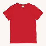Maxomorra Red Short Sleeve Top is made from GOTS organic cotton and is in a solid red colour, on a cream background