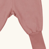 Maxomorra kids rib pants with elasticated cuffs in pink, made from GOTS organic cotton.