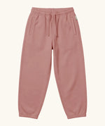 Maxomorra kids baggy sweat pants in solid pink, features a drawstring cord around the waist and side pockets