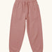 Maxomorra kids baggy sweat pants in solid pink, features a drawstring cord around the waist and side pockets
