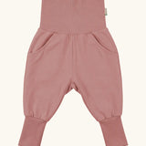 Maxomorra GOTS organic cotton waist sweat pants in solid pink. Features a elasticated waist band leg cuffs and side pockets