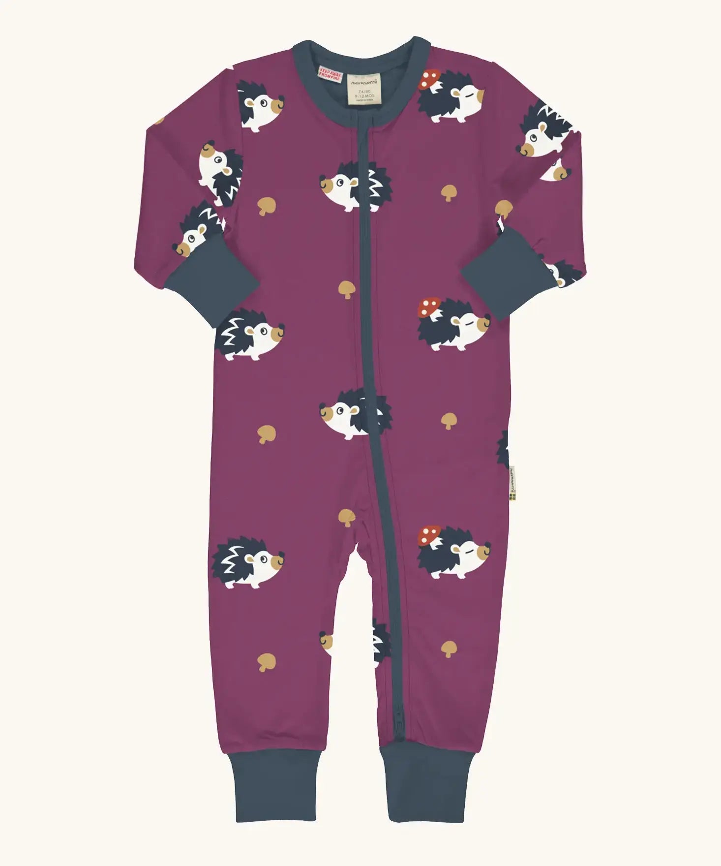 Maxomorra GOTS organic cotton baby long sleeve rompersuit in purple with a cute repeating hedgehog print, navy neck, cuffs and full front zip fastener