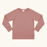 Maxomorra GOTS organic cotton long sleeve raglan top in solid pink. Features a crew neck line and fitted cuffs