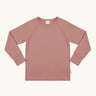 Maxomorra GOTS organic cotton long sleeve raglan top in solid pink. Features a crew neck line and fitted cuffs