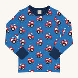 Maxomorra Organic Cotton Tractor Long Sleeved Children's Top is blue with a repeat red tractor print, and contrasting navy elasticated cuffs and neck trim