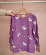 Maxomorra long sleeve kids top with unicorn print in purple with pink cuffs and piping, made from organic cotton.