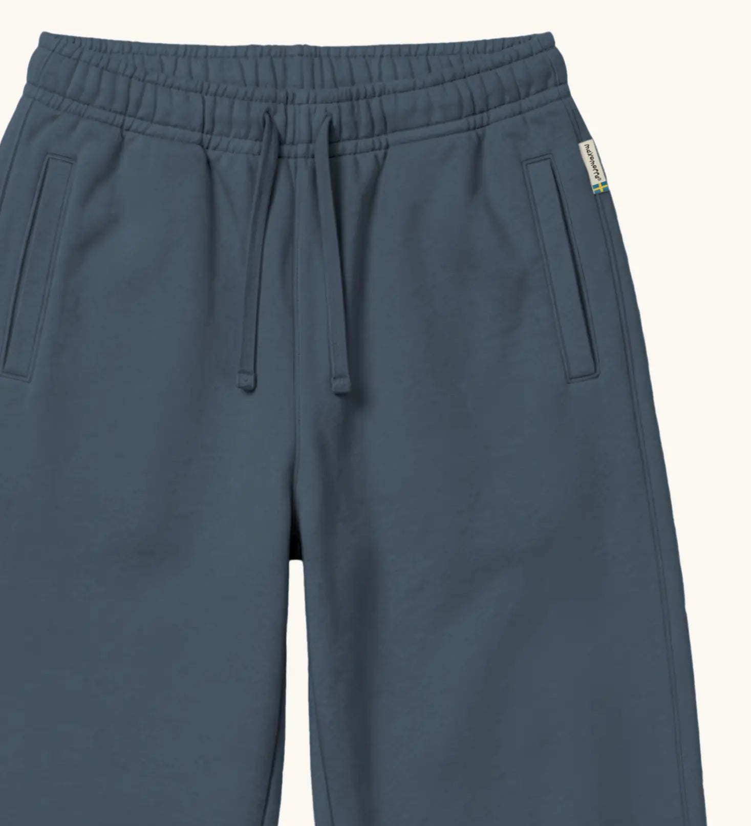Maxomorra kids joggers with elasticated waistband and pockets in blue, made from GOTS organic cotton.
