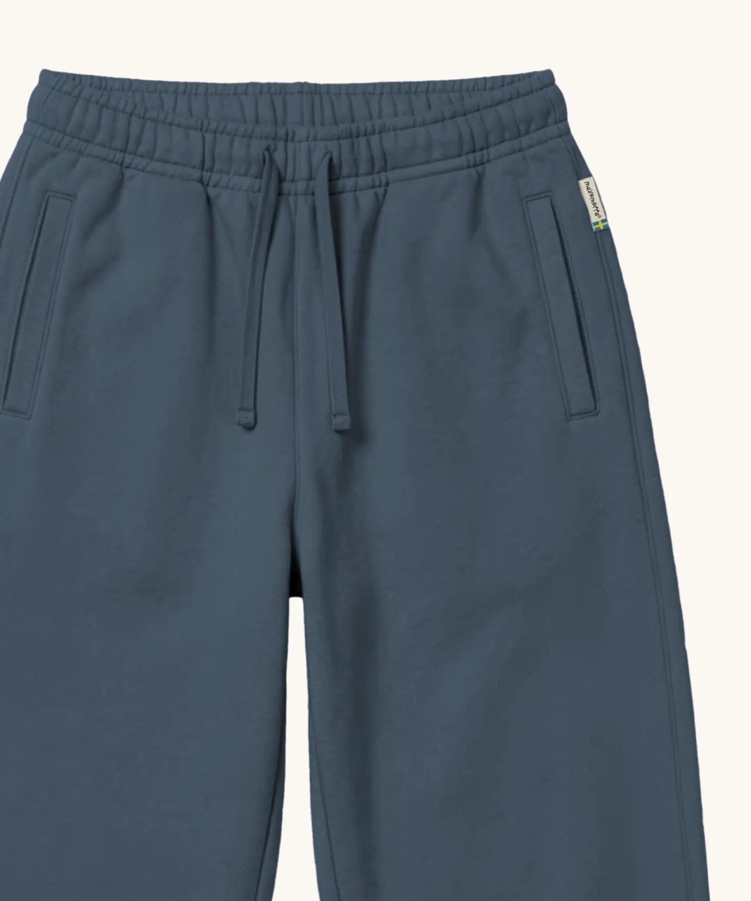 Maxomorra kids joggers with elasticated waistband and pockets in blue, made from GOTS organic cotton.