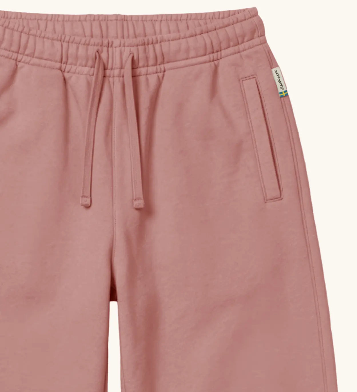 Maxomorra kids joggers with elasticated waistband and pockets in pink, made from GOTS organic cotton.
