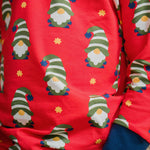 A super close up photo of the Maxomorra Swedish Santa print top showing the details on the print. 
