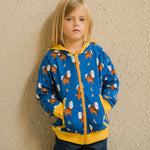 A child wearing a Maxomorra Wolf Reversible Zip Hoodie. The child has his hands in his pockets. 