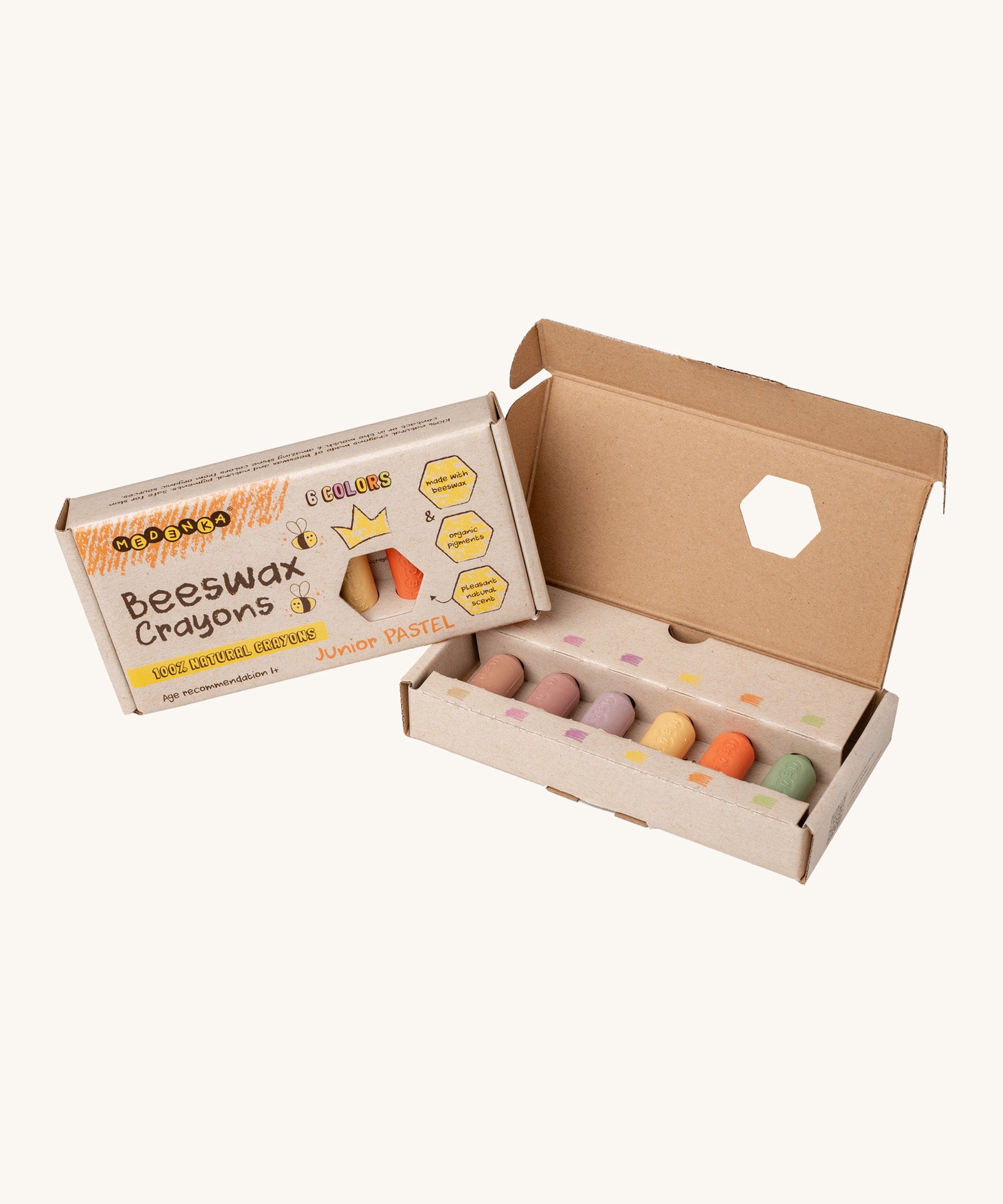 An opened packaging box showing the six pastel coloured junior beeswax crayons from Medenka. 